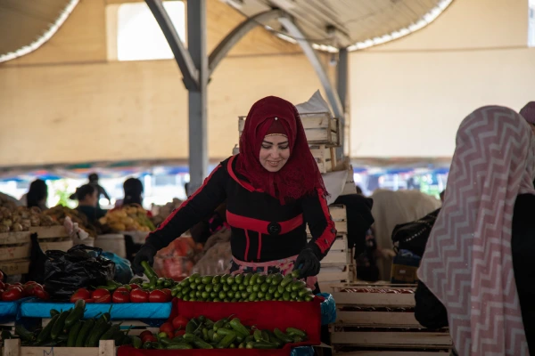 red-scarf-woman-selling-cucumber